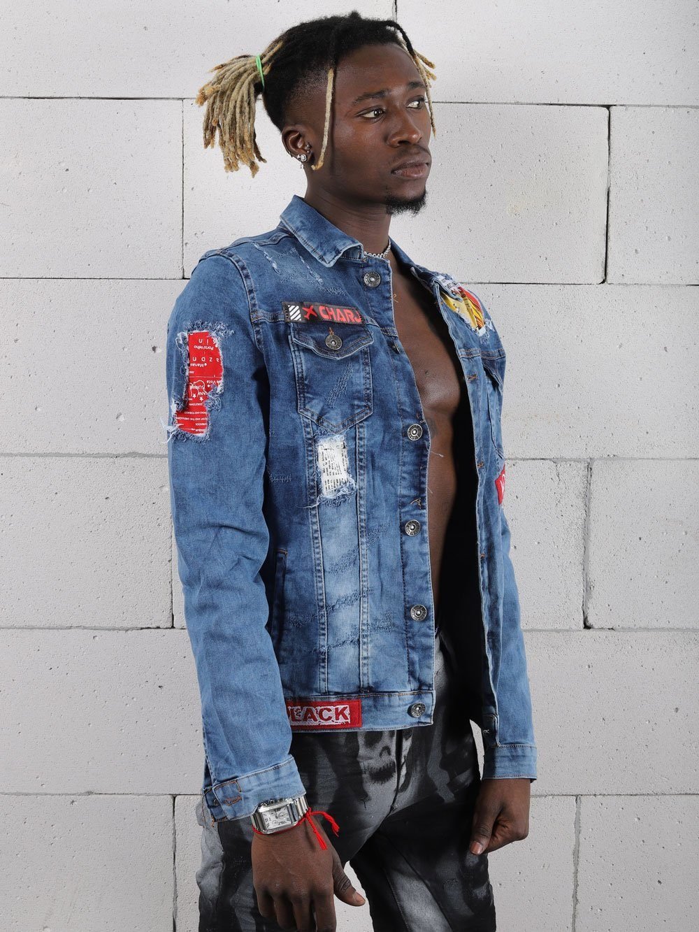 A man wearing Monday denim jacket and jeans.